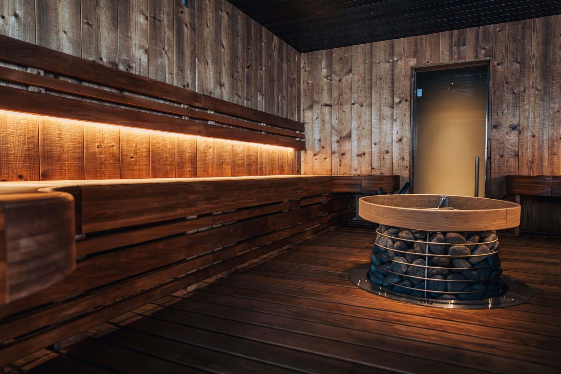 A wooden sauna interior with warm light